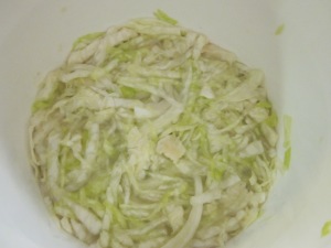 Shredded cabbage releasing its juices.